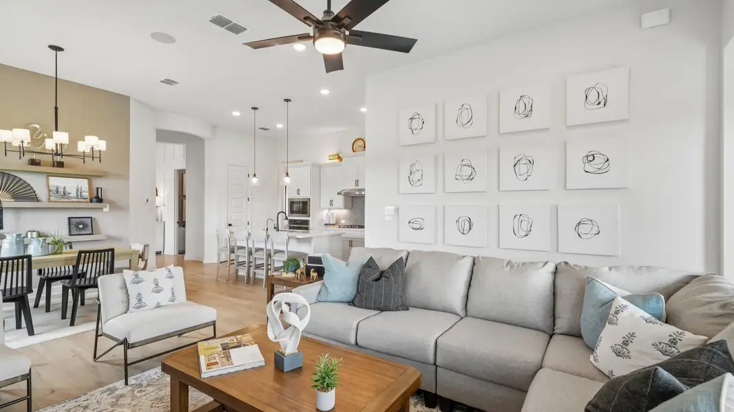 Open and airy great room seamlessly flowing into the dining area and kitchen with abundant natural light Open and airy great room seamlessly flowing into the dining area and kitchen with abundant natural light