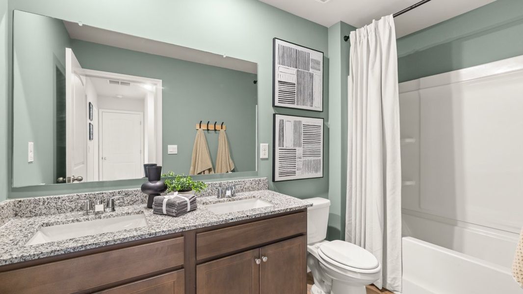 Furnished interior in a model home at Carlton in Douglasville (Image 17).