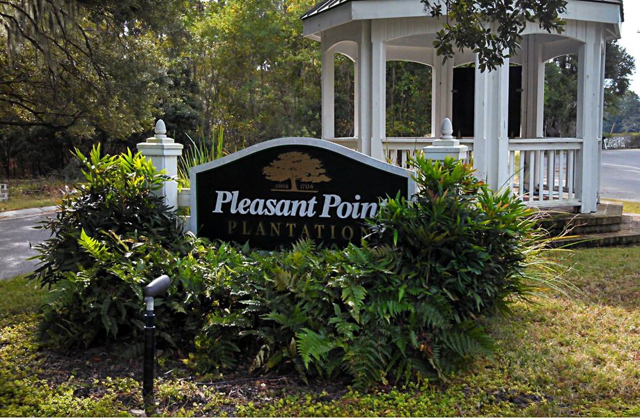 Entrance to the Pleasant Point Plantation community in Beaufort, SC, featuring signage and landscaping (Image 1).