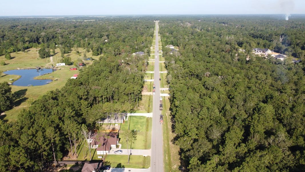 Aerial view of the Encino Estates community in Dayton, TX, showing layout and nearby surroundings (Image 2). Aerial view of the Encino Estates community in Dayton, TX, showing layout and nearby surroundings (Image 2).
