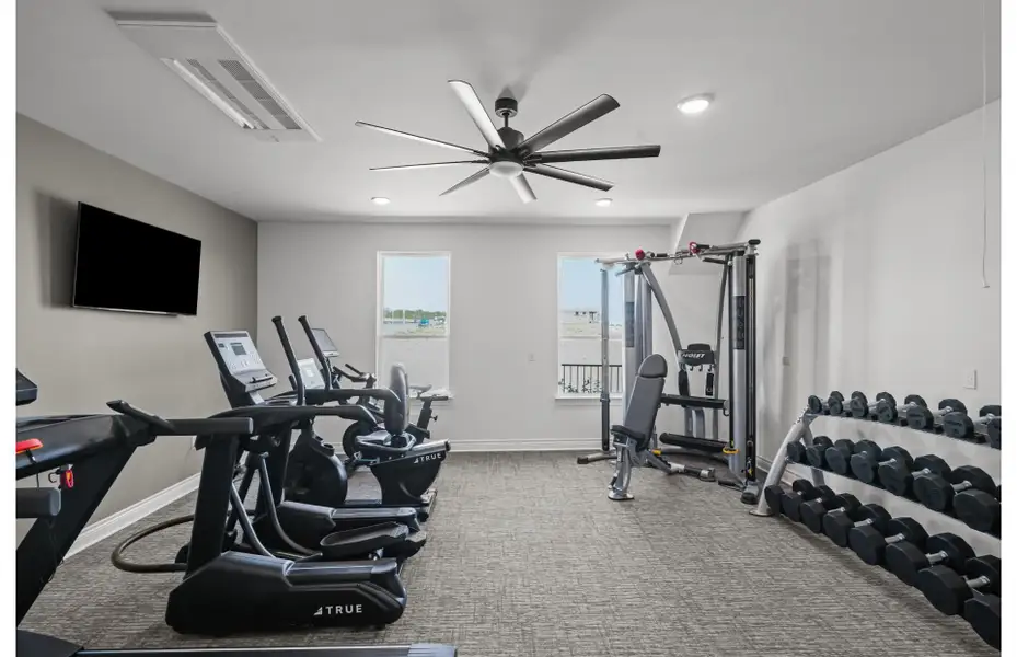 Well-equipped fitness room with cardio and strength equipment for residents. Well-equipped fitness room with cardio and strength equipment for residents.