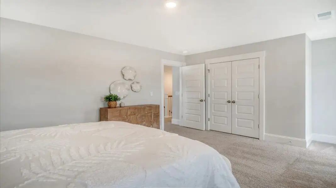 Furnished interior in a model home at Wappetaw Woods in Awendaw (Image 22).