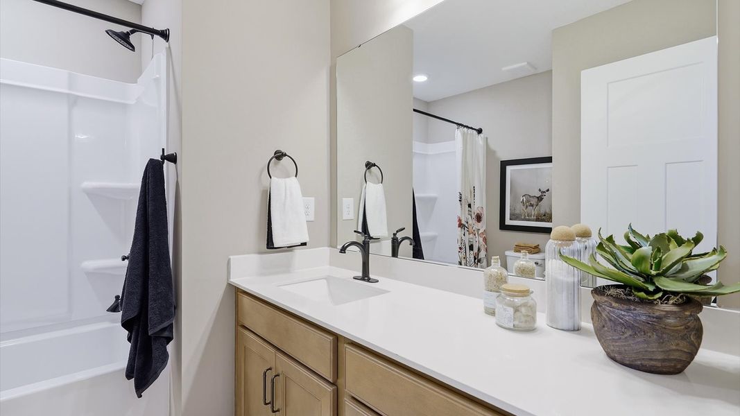 Top-notch bathroom with current fixtures, tasteful materials, and elevated charm at Brookland Place