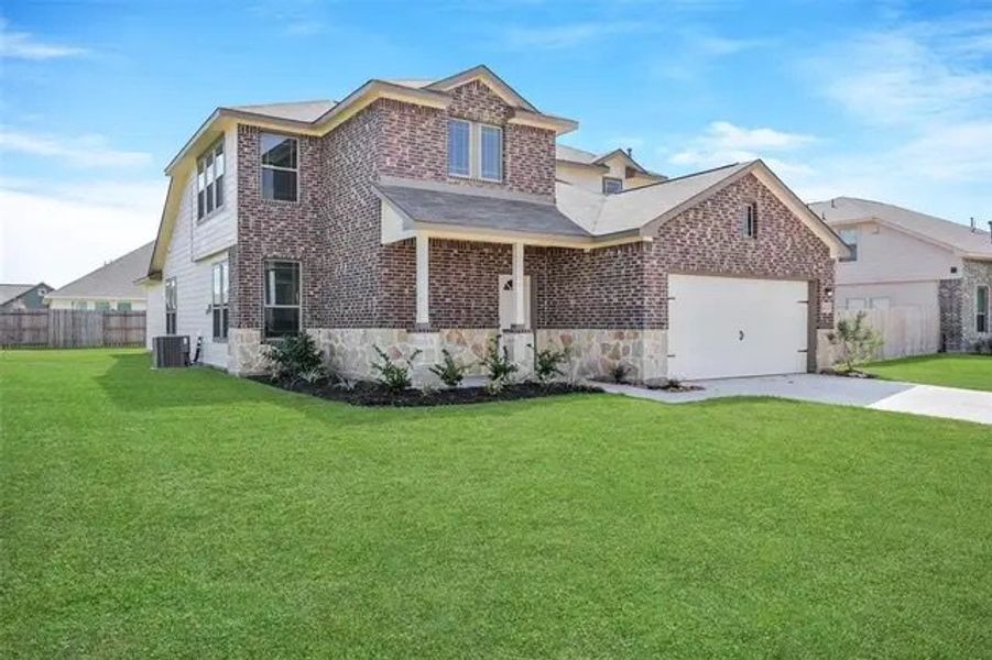 Front exterior of a home in the Clear View Estates community, located in Willis, TX (Image 4).
