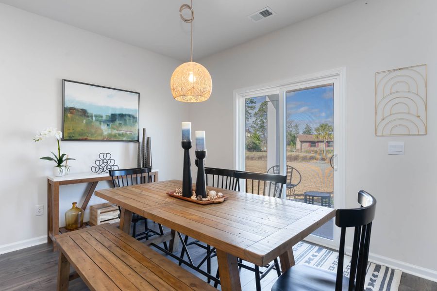 Furnished interior in a model home at Island Green in Myrtle Beach (Image 29).