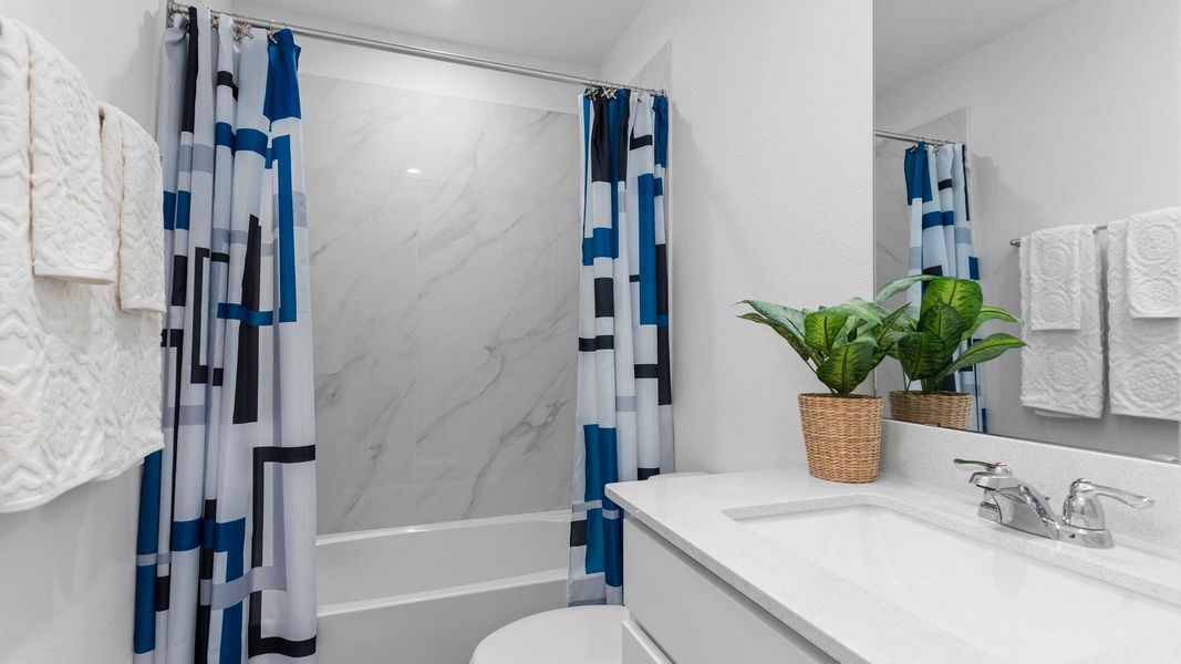 Furnished interior in a model home at August Trails in Needville (Image 9).
