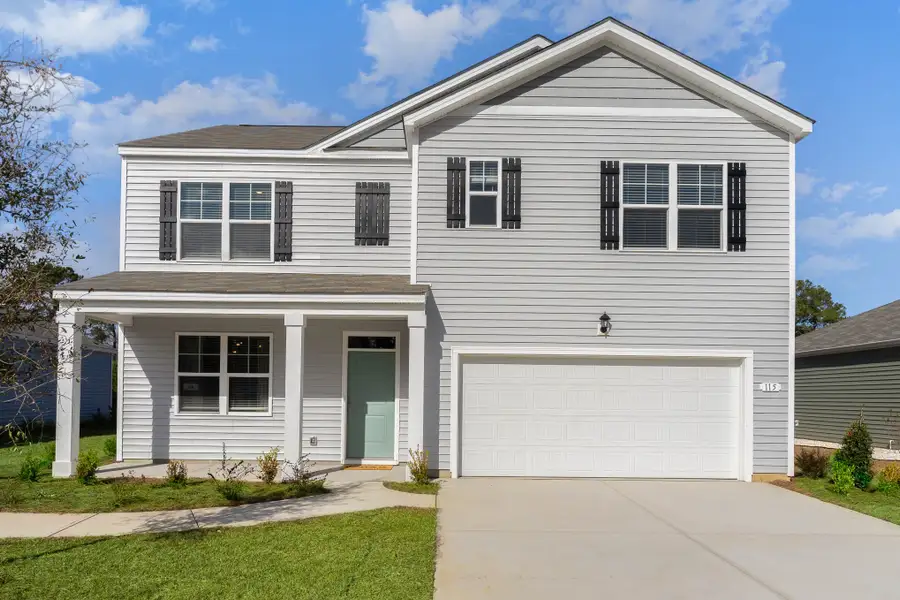 Front exterior of a home in the Island Green community, located in Myrtle Beach, SC (Image 1).