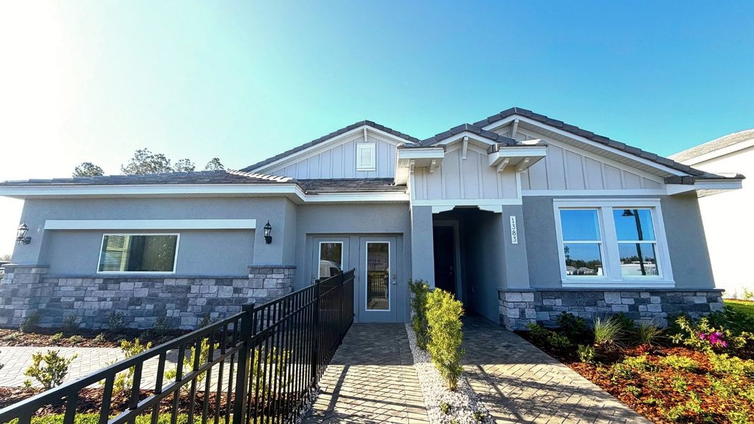 Front exterior of a home in the Hammock at Two Rivers community, located in Zephyrhills, FL (Image 2). Front exterior of a home in the Hammock at Two Rivers community, located in Zephyrhills, FL (Image 2).