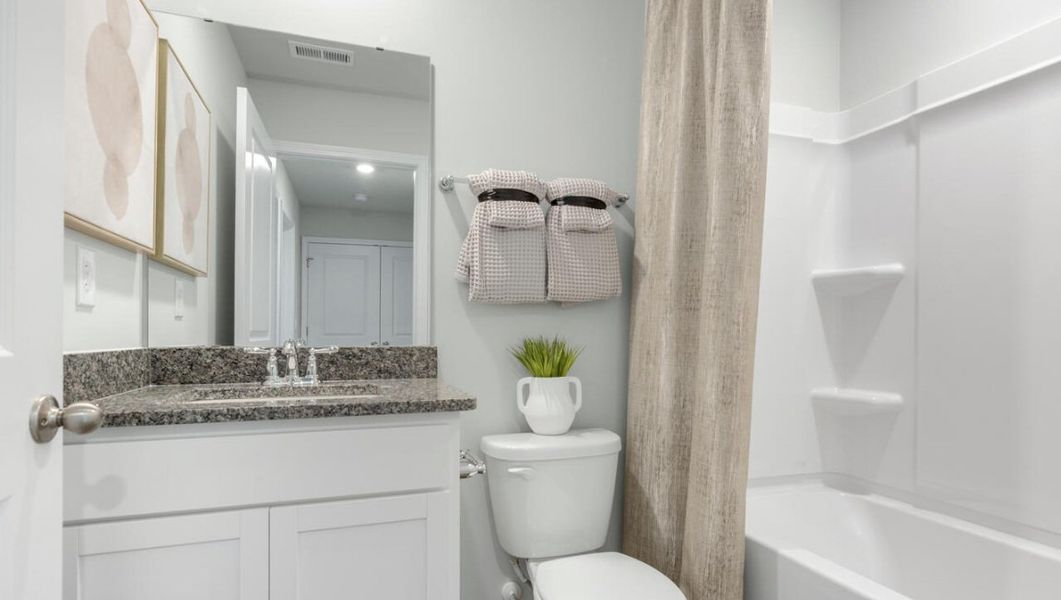 Furnished interior in a model home at Waterside Townhomes in Surf City (Image 24).