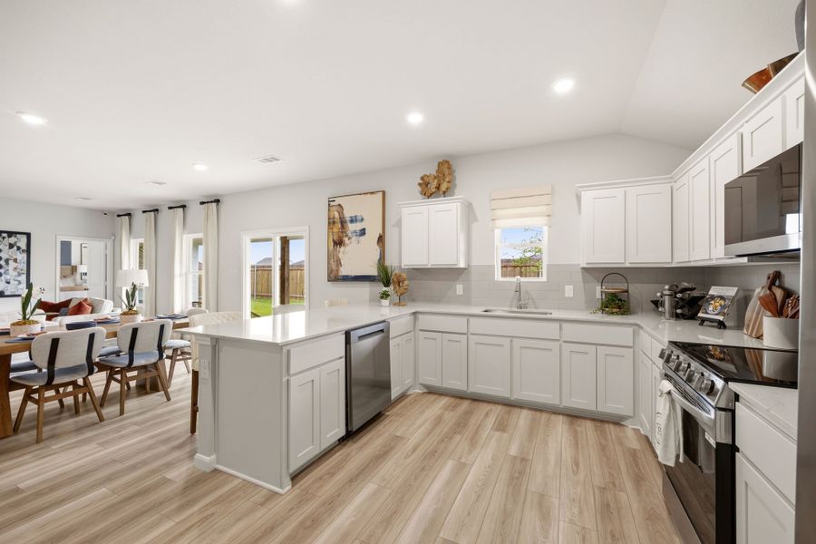 A kitchen with white cabinets. A kitchen with white cabinets.
