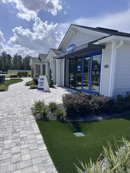 A charming sales center with manicured landscaping in Sandridge Hills by Mattamy Homes (Green Cove Springs, FL).