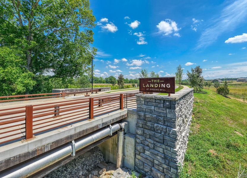 Entrance to the The Landing at Greens Mill community in Columbia, TN, featuring signage and landscaping (Image 2). Entrance to the The Landing at Greens Mill community in Columbia, TN, featuring signage and landscaping (Image 2).