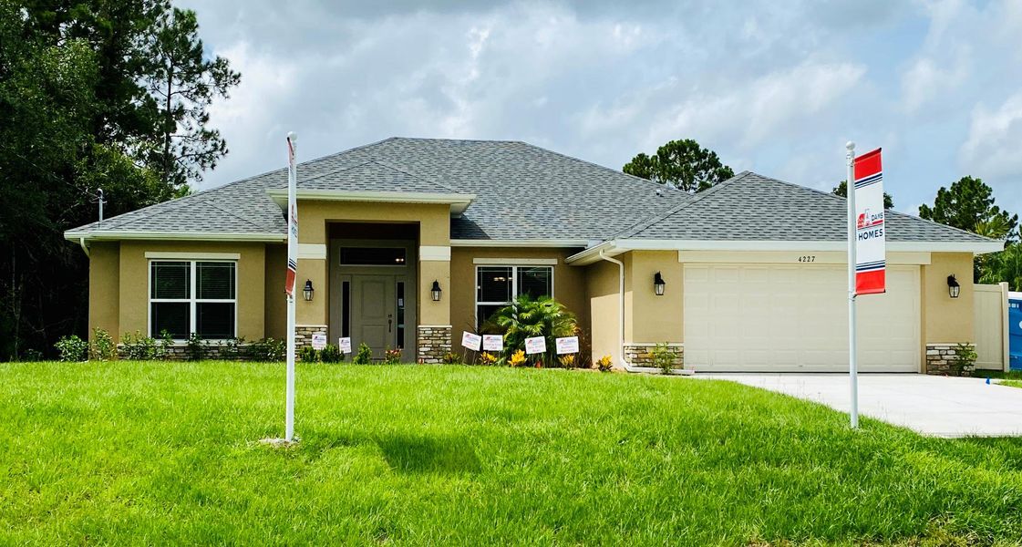 Front exterior of a home in the North Port community, located in North Port, FL (Image 1).