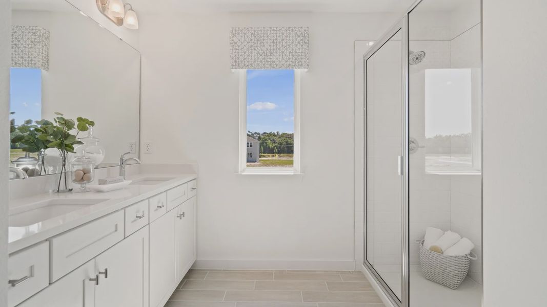 Primary Suit Bathroom with natural lighting at DRB homes