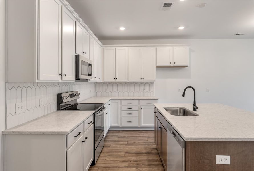 Furnished interior in a model home at 1158 Place Townhomes in Wilson (Image 11). Furnished interior in a model home at 1158 Place Townhomes in Wilson (Image 11).