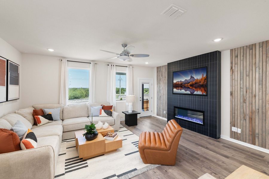 A living room with a fireplace.