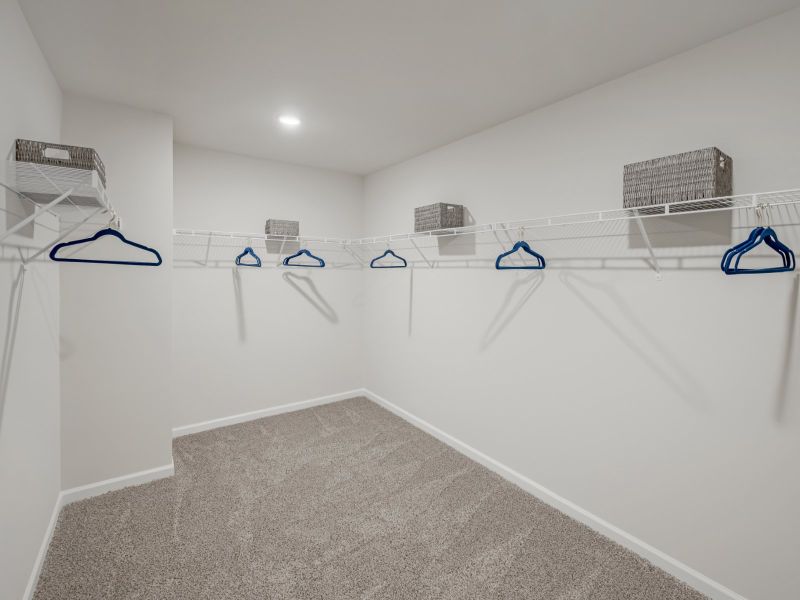 The spacious walk-in closet is attached to the primary bathroom.