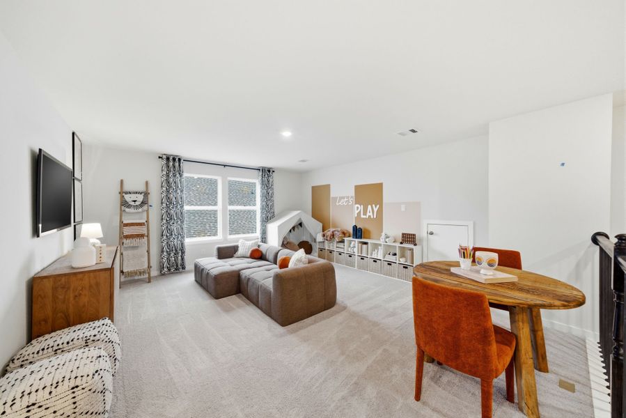 A living room with a couch and a table. A living room with a couch and a table.