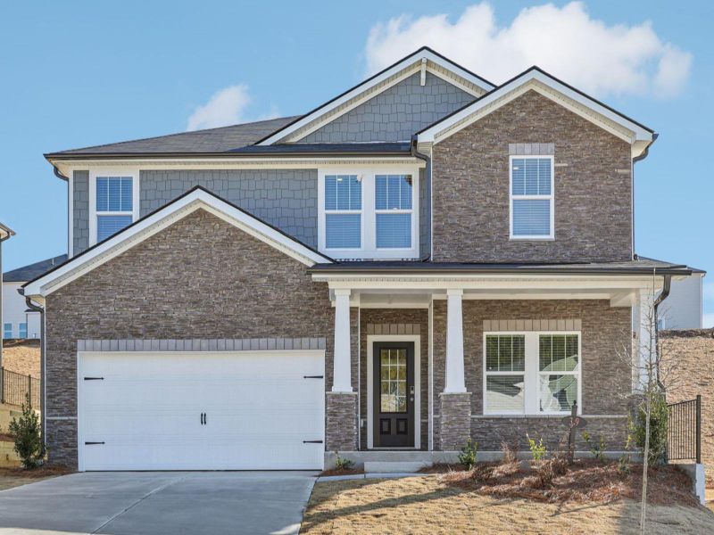 Front exterior of a home in the Vines at Mill Creek - Estate Series community, located in Braselton, GA (Image 1). Front exterior of a home in the Vines at Mill Creek - Estate Series community, located in Braselton, GA (Image 1).