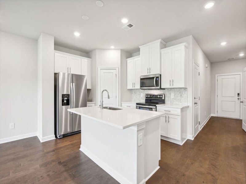 Furnished interior in a model home at Rocky River Towns in Charlotte (Image 6).