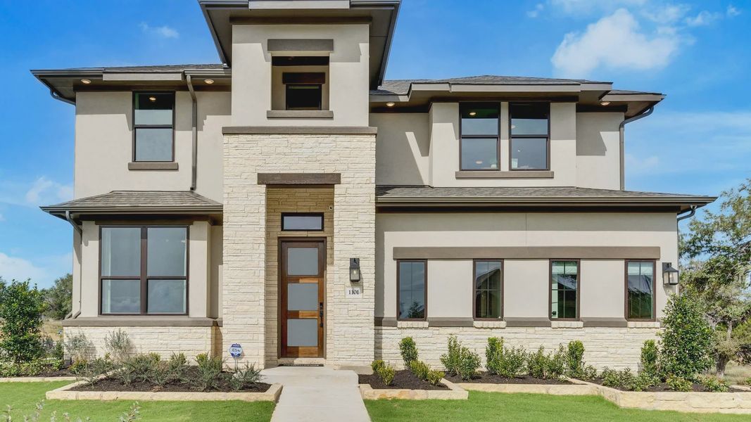 Elegant two-story home featuring stone accents and sleek stucco facade in San Gabriel, Texas. Elegant two-story home featuring stone accents and sleek stucco facade in San Gabriel, Texas.