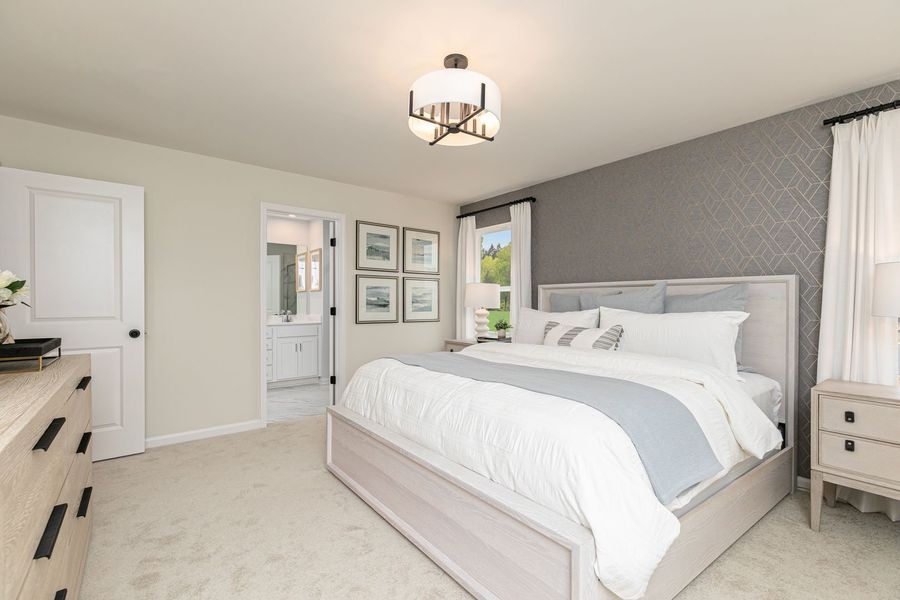 Unwind and refresh in a serene primary suite