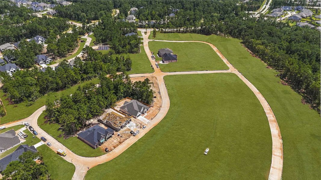 Aerial view of the The Woodlands Hills community in Willis, TX, showing layout and nearby surroundings (Image 9).