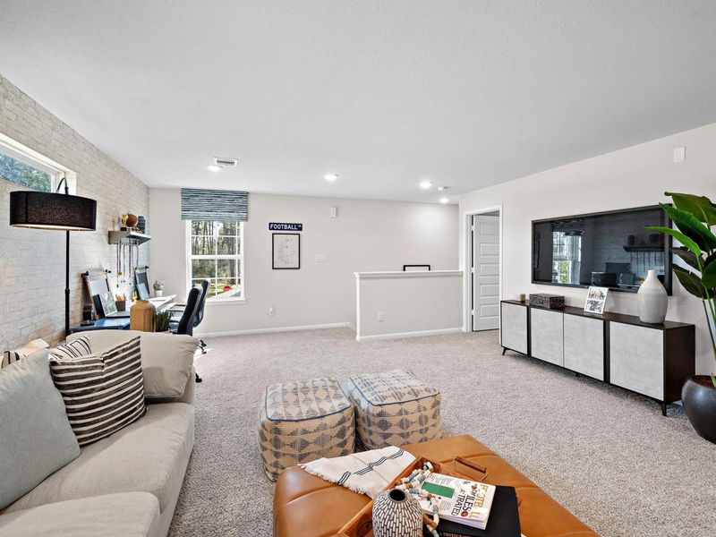 Furnished interior in a model home at Lakes at Black Oak in Magnolia (Image 29).