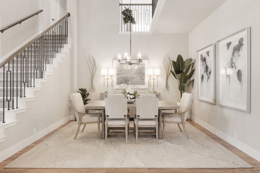 Formal dining room with six-chair table, chandelier, high ceilings, and staircase nearby on hardwood floors