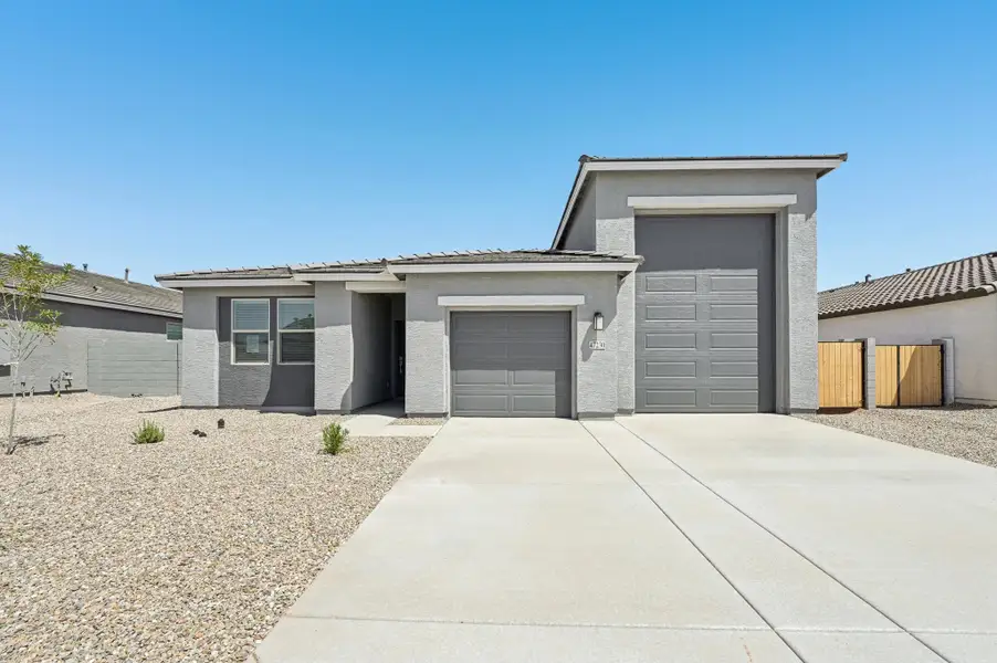 Front exterior of a home in the Sol at Amarillo Creek community, located in Maricopa, AZ (Image 4).