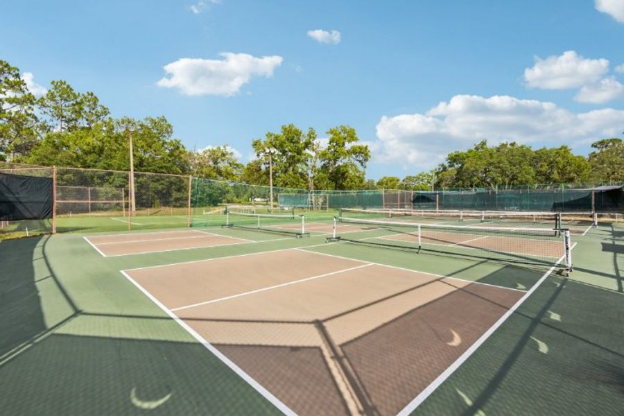 A tennis court with a net.