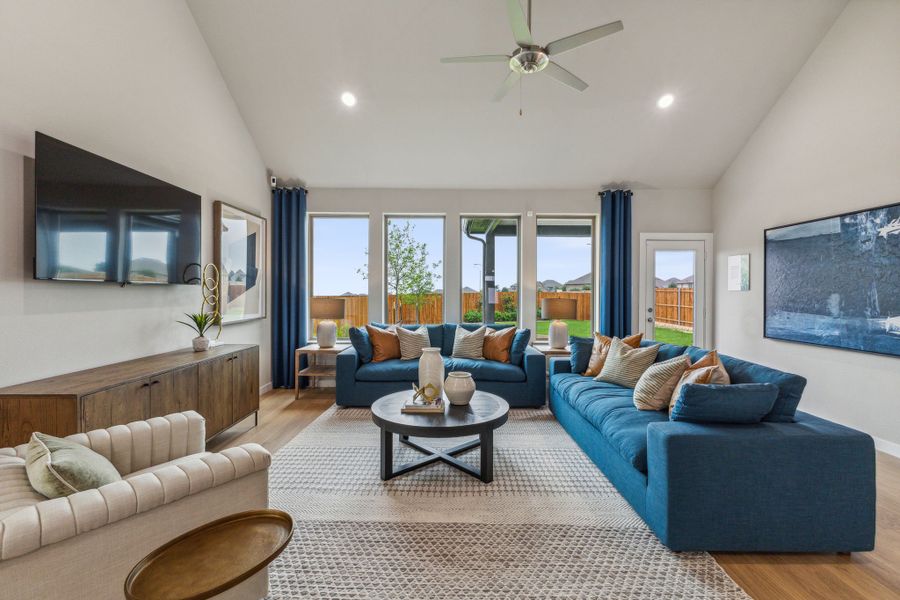 REPRESENTATIVE PHOTO – Living room in a Tesoro at Chisholm Trail Ranch new home in Crowley TX by Trophy Signature Homes