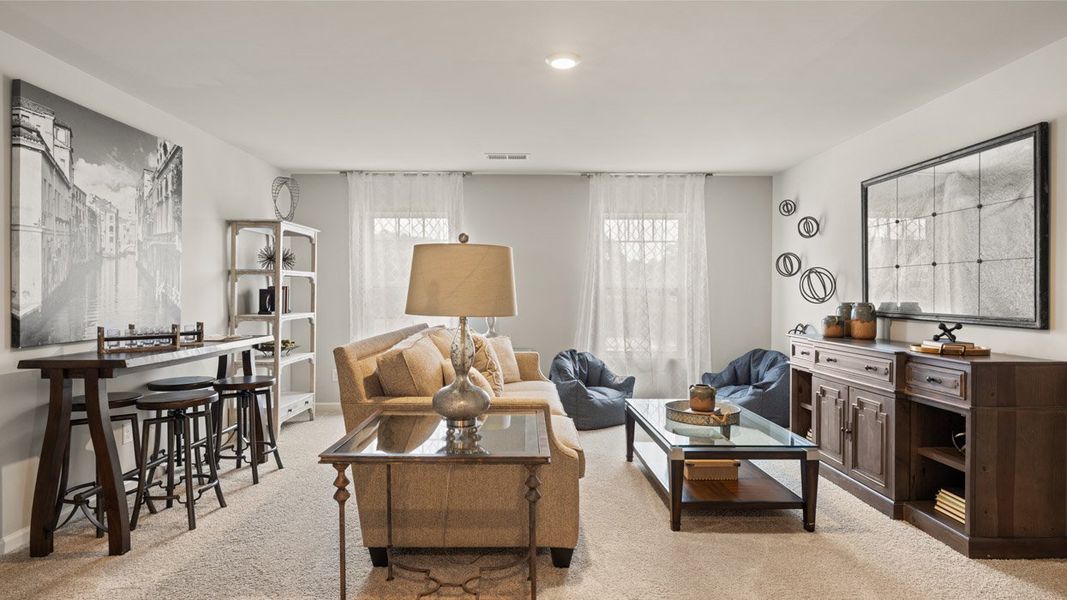 Furnished interior in a model home at Highland Hills in Graniteville (Image 17).