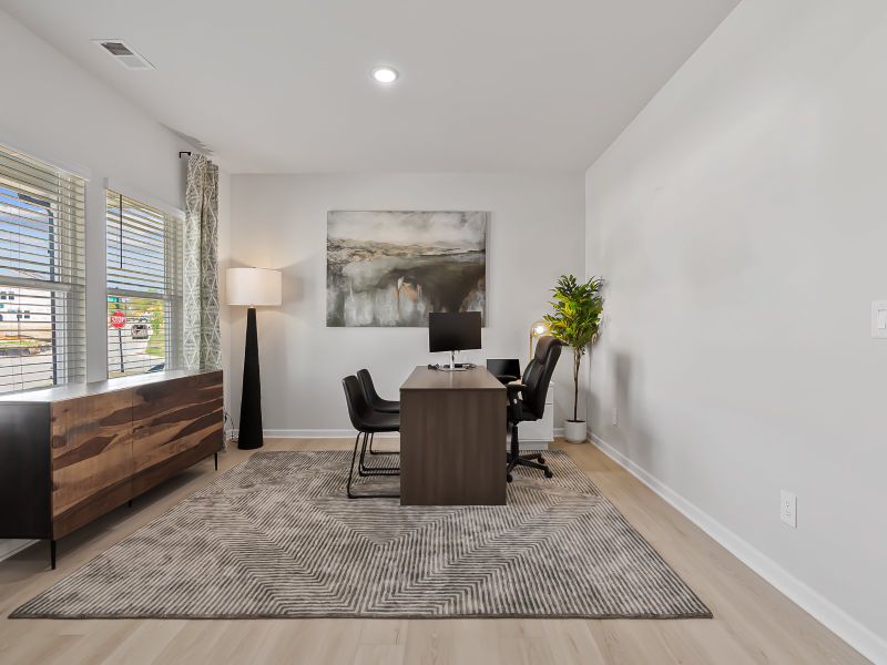 Skip your commute and outfit the downstairs flex space as your home office.