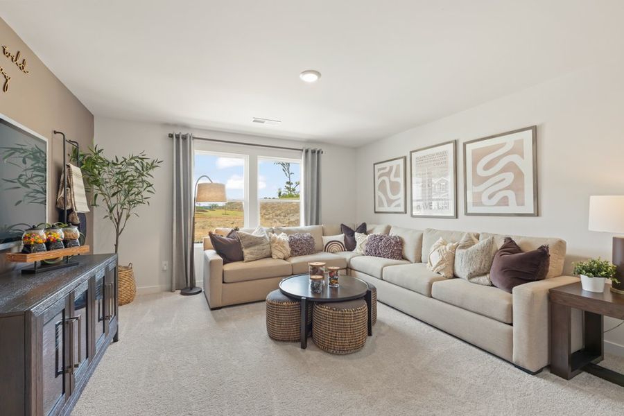 A living room with a couch and a coffee table. A living room with a couch and a coffee table.