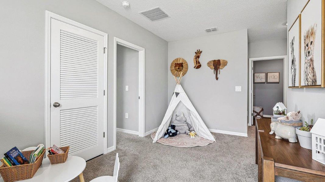 Furnished interior in a model home at Wynnstone in Davenport (Image 28).