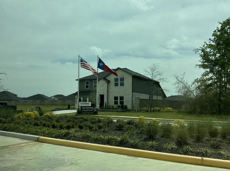 A beautiful model home with landscaped garden in The Canopies by D.R. Horton, set in Splendora, TX. A beautiful model home with landscaped garden in The Canopies by D.R. Horton, set in Splendora, TX.