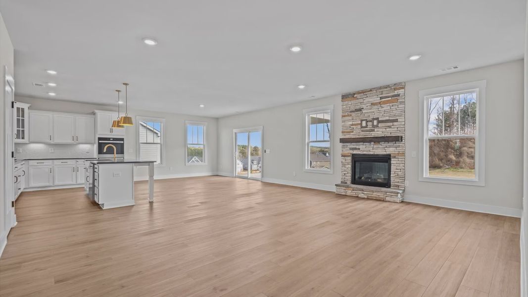 Family room with vaulted ceilings, and fireplace