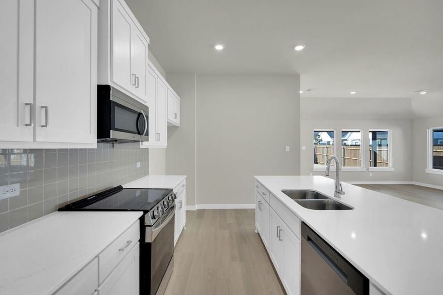 Furnished interior in a model home at South Meadow in Melissa (Image 6).