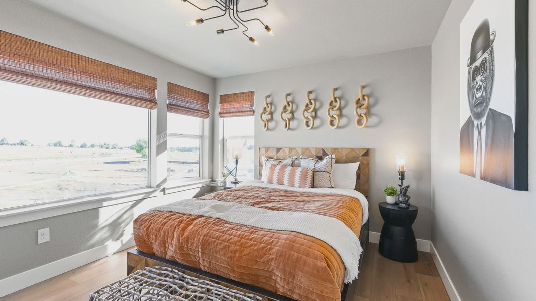 Experience luxury with soft lighting, elegant woodwork, and expansive views in Dillon Pointe's modern bedroom. Experience luxury with soft lighting, elegant woodwork, and expansive views in Dillon Pointe's modern bedroom.