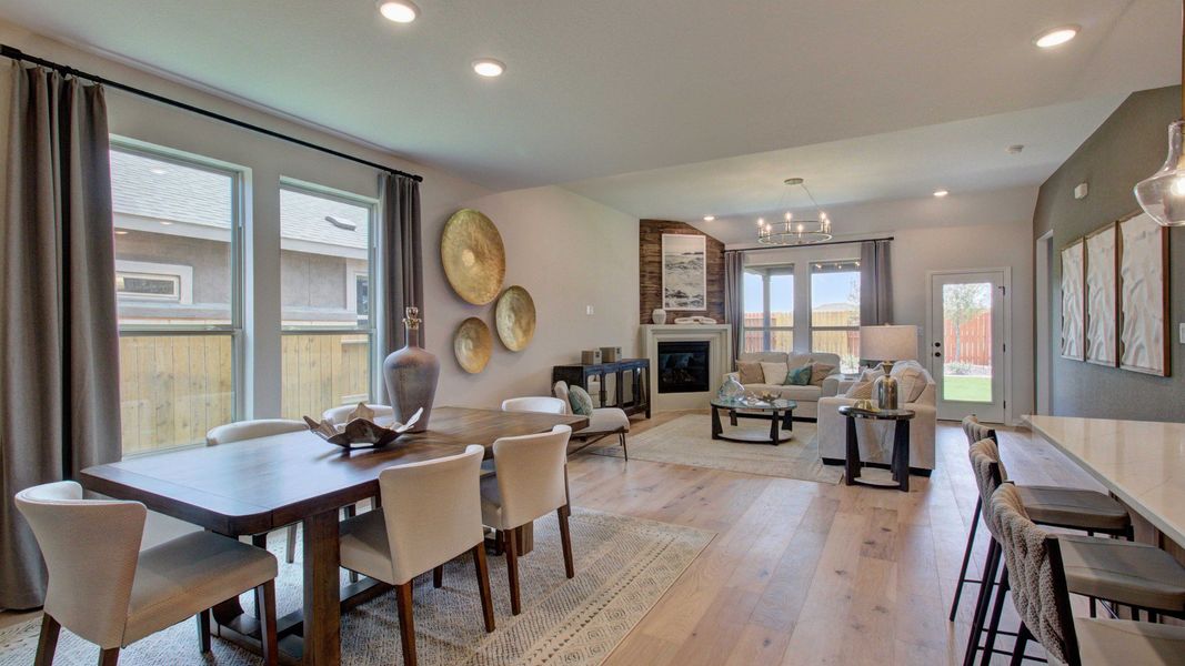 Elegant hardwood floors and a chic fireplace highlight this Meyer Ranch home's luxurious living space.