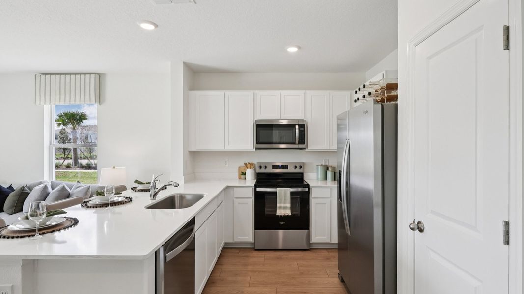 Furnished interior in a model home at Towns at Woodsdale in Wesley Chapel (Image 8).