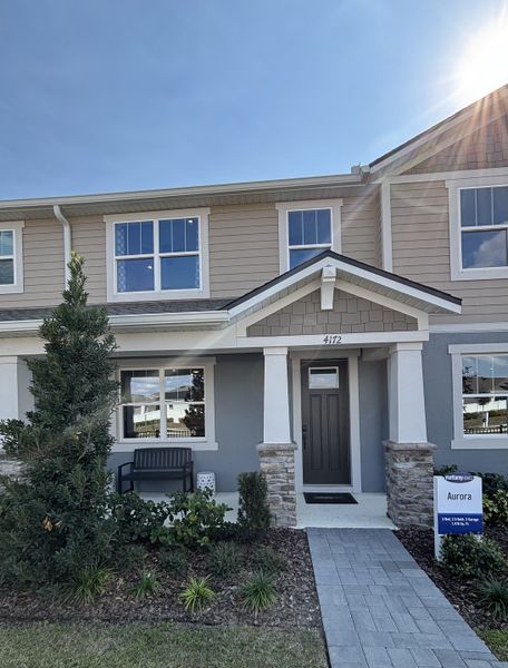 A charming two-story home with stone accents in Gardenia Reserve by Mattamy Homes, Apopka, FL.