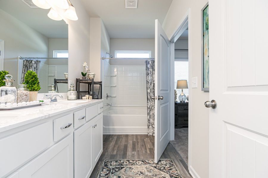 Furnished interior in a model home at The Cottages of Silvertown in Thomaston (Image 38).