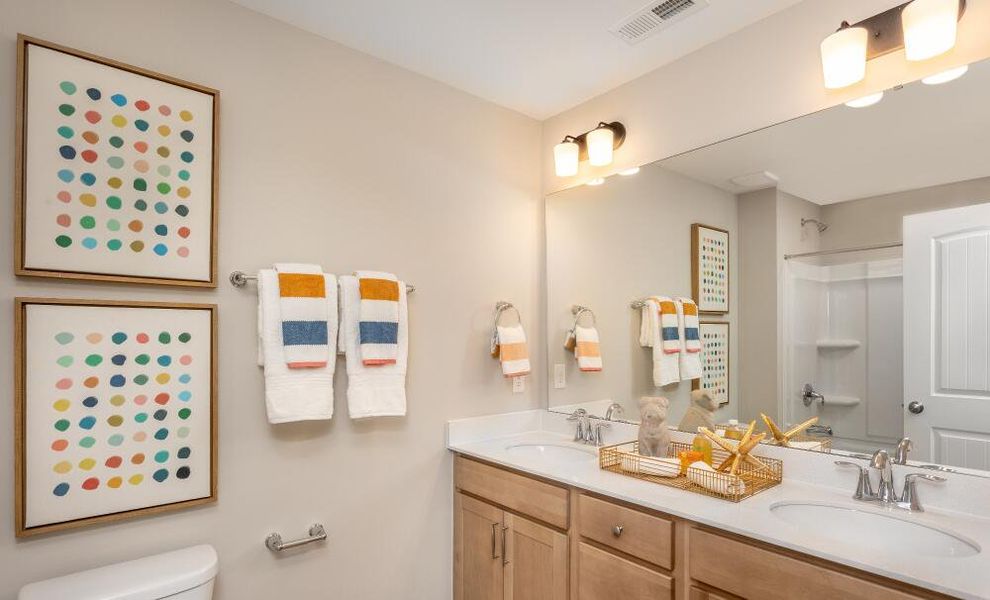 Furnished interior in a model home at Running Brook Townes in Durham (Image 15).