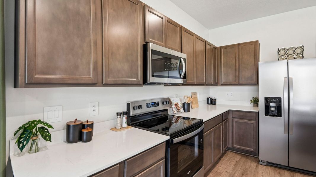 Furnished interior in a model home at Sanctuary at Citrus Park Townhomes in Tampa (Image 12).