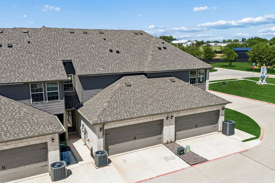 Front exterior of a home in the Sanger Circle – Townhomes community, located in Sanger, TX (Image 32). Front exterior of a home in the Sanger Circle – Townhomes community, located in Sanger, TX (Image 32).
