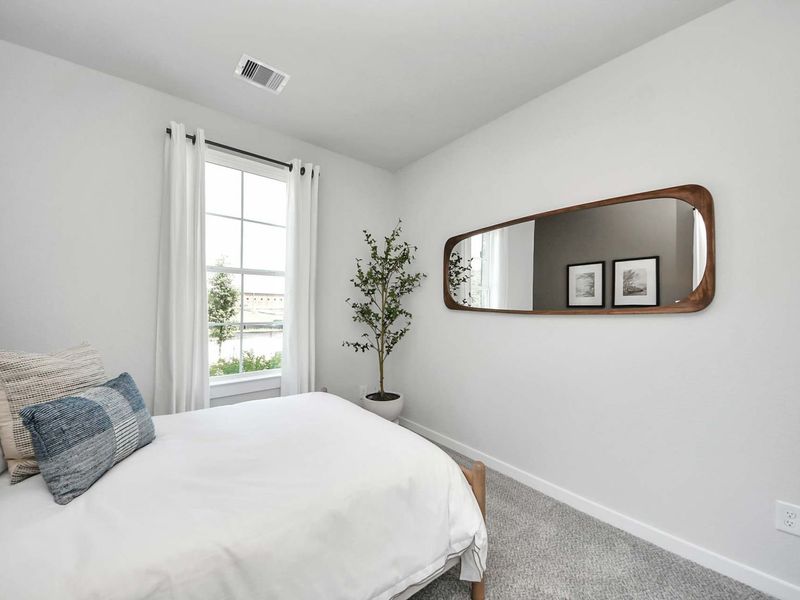 Furnished interior in a model home at Enclave at Newport in Crosby (Image 11).