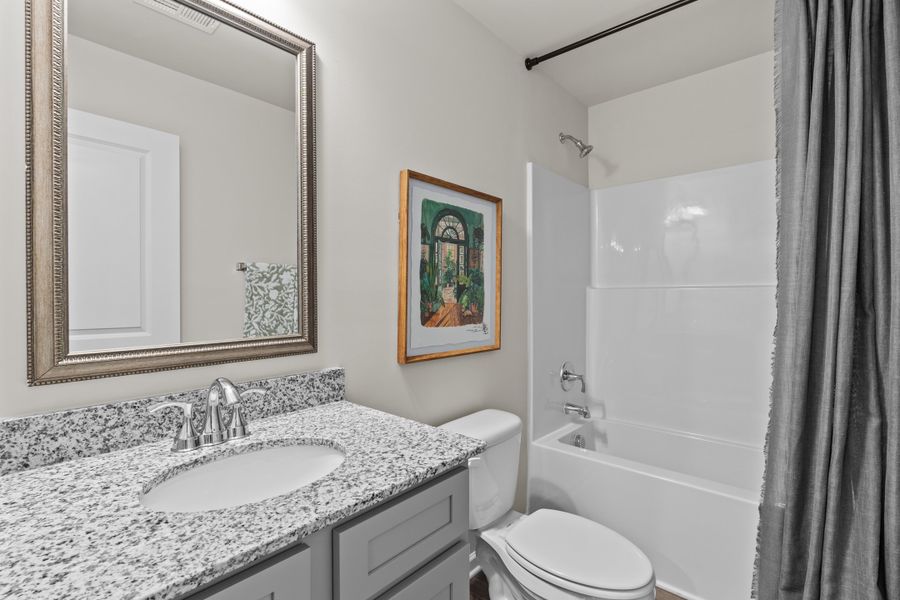 Furnished interior in a model home at Canary Woods in Hopkins (Image 23).