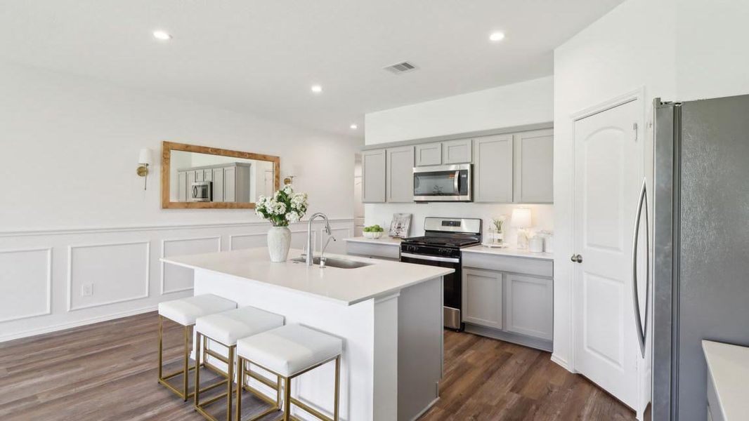 Furnished interior in a model home at Grand Pines in Magnolia (Image 7).